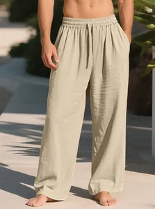 Detailed texture of loose-fitting beige men's linen casual pants with drawstring