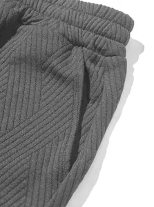 Close-up of men's knit jacquard shorts showing waistband and pocket texture detail