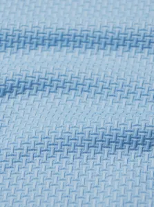 Close-up of breathable blue ice-feeling fabric with micro-woven texture for Polo shirts