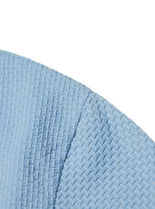 Macro view of the light blue ice-feel textured fabric on a men's summer casual polo shirt