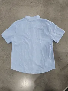 Detailed back view of men's summer light blue linen stand collar short sleeve shirt