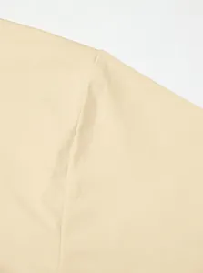 Close-up detail showing the shoulder seam and breathable fabric of a beige quick-dry T-shirt