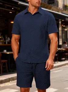 Detailed view of men's navy blue jacquard textured short sleeve shirt and shorts set.