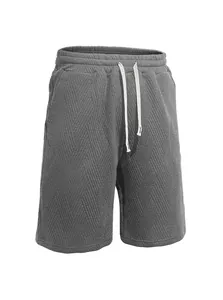 Detail view of men's gray jacquard knit shorts with drawstring elastic waist for sports.