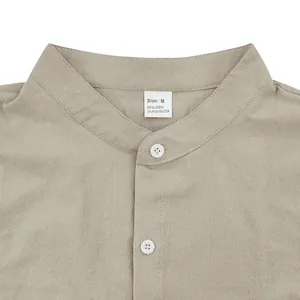 Detailed view of men's linen stand collar shirt showing fabric texture and neck label info