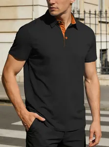 Detailed shot of black men's polo shirt featuring orange inner collar and textured fabric