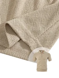 Detail of textured towel jacquard fabric on a men's business casual polo shirt