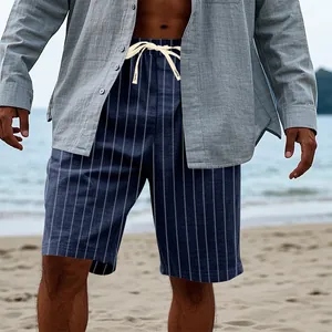 Detailed view of men's blue vertical striped linen-look beach shorts on a model