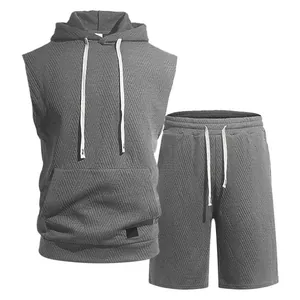 Macro view of men's grey jacquard knit sleeveless hoodie and shorts athletic set