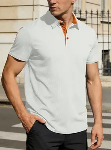 Close-up of men's white polo shirt featuring a stylish contrast orange collar and button placket