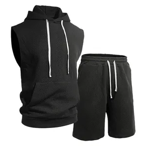 Detailed view of the black jacquard knit texture on this hooded sleeveless vest set.