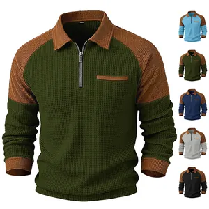 Detailed view of men's waffle knit half-zip polo shirt with multiple color variant options