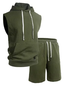 Detail of olive green textured knit sleeveless hoodie and matching sports shorts set.