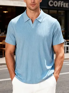 Close-up of light blue men's textured polo shirt in an outdoor street setting