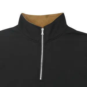 Close-up detail of men's black outdoor half-zip sweatshirt with brown stand collar