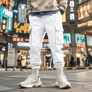 High-quality detail of white multi-pocket cargo pants with elasticated jogger cuffs
