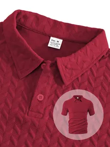 Detail of burgundy men's polo shirt with herringbone jacquard texture and size tag.