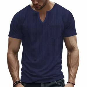 Detail view of men's navy blue V-neck T-shirt with textured waffle fabric and pocket