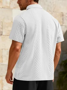 Macro view of white men's polo shirt featuring an intricate diamond jacquard pattern
