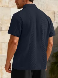 Detailed view of men's navy jacquard polo shirt featuring breathable textured fabric