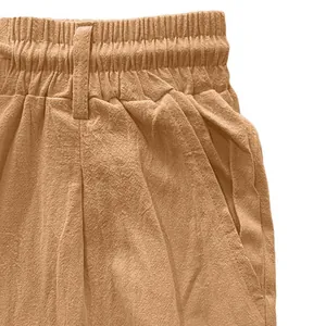 Close-up detail of breathable linen fabric and elastic waistband on men's casual pants