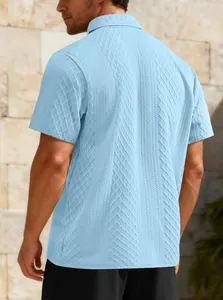 Detailed rear view of a men's light blue jacquard textured polo shirt with short sleeves