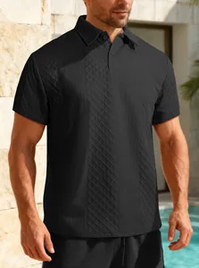 Detailed macro view of black textured jacquard fabric on a men's casual polo shirt
