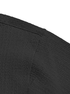 Detailed macro shot of black men's short sleeve shirt showing wavy fabric texture