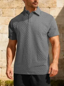 Detailed view of grey short-sleeve polo shirt featuring intricate jacquard texture.