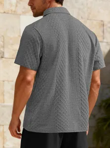 Back view of men's grey short-sleeved polo shirt with textured jacquard patterns.