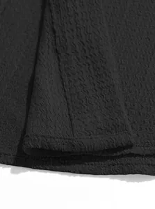 Macro detail of black seersucker textured fabric on men's business casual shirt