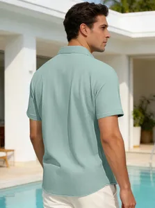 Detailed back view of a men's sage green waffle-knit short-sleeve polo shirt