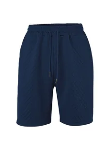 Vue détaillée du short jacquard pour homme bleu foncé avec cordon de serrage et tissu texturé.