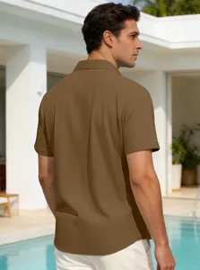 Macro view of brown textured short-sleeve shirt showing high-quality fabric and relaxed fit.