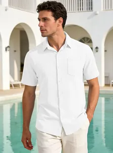 Caucasian male in white short-sleeve button-down shirt with chest pocket outdoors