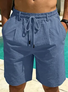 Close-up of men's blue quick-dry beach shorts with drawstring waist and textured fabric