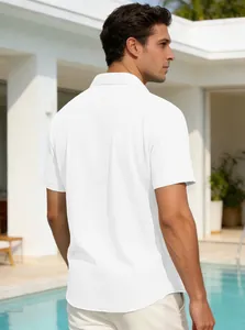 Back view of a white textured short-sleeve polo shirt for men in a poolside setting