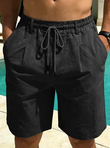Detail view of men's quick-dry breathable beach shorts with elastic drawstring waist.