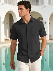 Close-up of black short sleeve textured button-down shirt worn by model