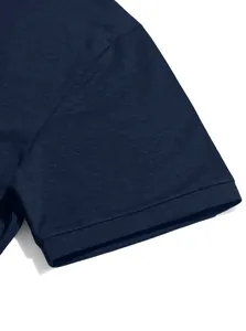 Close-up of navy blue short sleeve showing fine cotton fabric texture and stitching detail