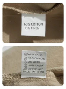 Détail de l'étiquette de lavage d'un t-shirt en coton et lin, composition 65% coton et 35% lin