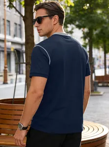 Back view of a navy blue men's casual polo shirt featuring white stitching details
