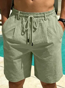Detailed view of men's casual light green cotton linen beach shorts with adjustable drawstring