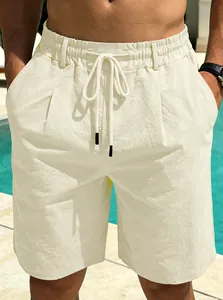 Detail view of men's cream cotton linen beach shorts with adjustable drawstring waist