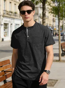 Detailed view of a men's charcoal grey Henley collar short sleeve shirt featuring a chest pocket