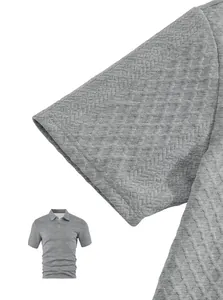 Macro view of grey men's polo shirt highlighting the premium textured jacquard fabric detail
