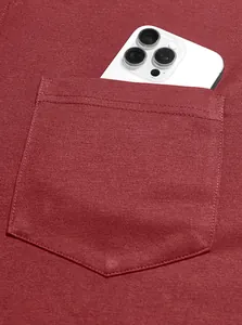 Close-up detail of a maroon business casual polo shirt pocket with a smartphone inside