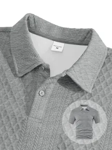Detailed close-up of grey men's polo shirt showing textured jacquard fabric and collar