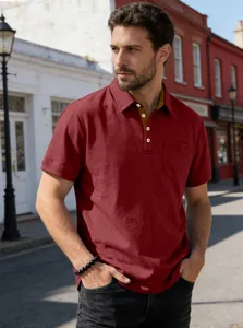 Detail view of maroon business casual polo shirt featuring contrasting placket and pocket