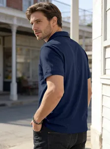 Side view of navy blue men's polo shirt with chest pocket and relaxed business casual fit